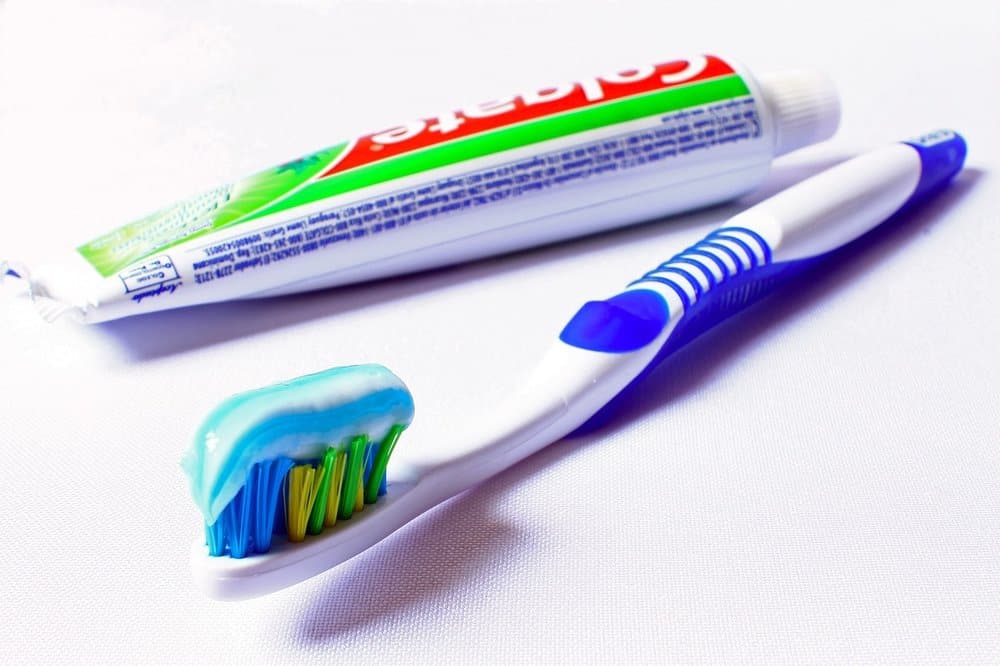 Toothbrush with colgate toothpaste on it